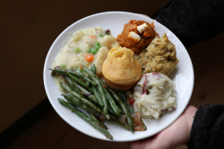 Picture of meal from Mean Greens Cafe featuring green beans, mashed potatoes, sweet potatoes and a corn muffin
