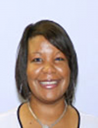 Picture of Staff Senator Amaya Spencer. Amaya has a black bob, brown eyes and is smiling. Amaya has on a white top with a black collar and is against a white background 