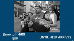 A photo from the Boston Marathon Bombing from 2013. A child and adult running from the scene of an explosion. The adult is holding another adult who is injured.